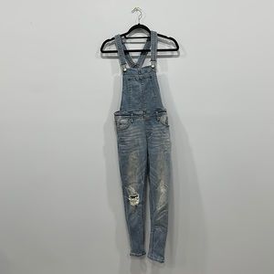 Light wash ripped distressed denim overalls